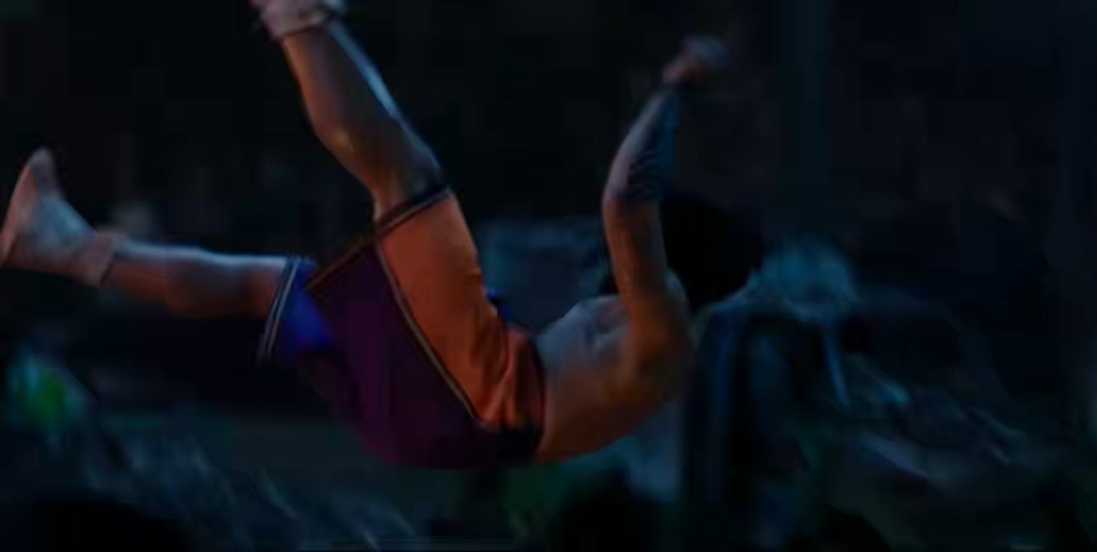 A fighter flies through the air at night