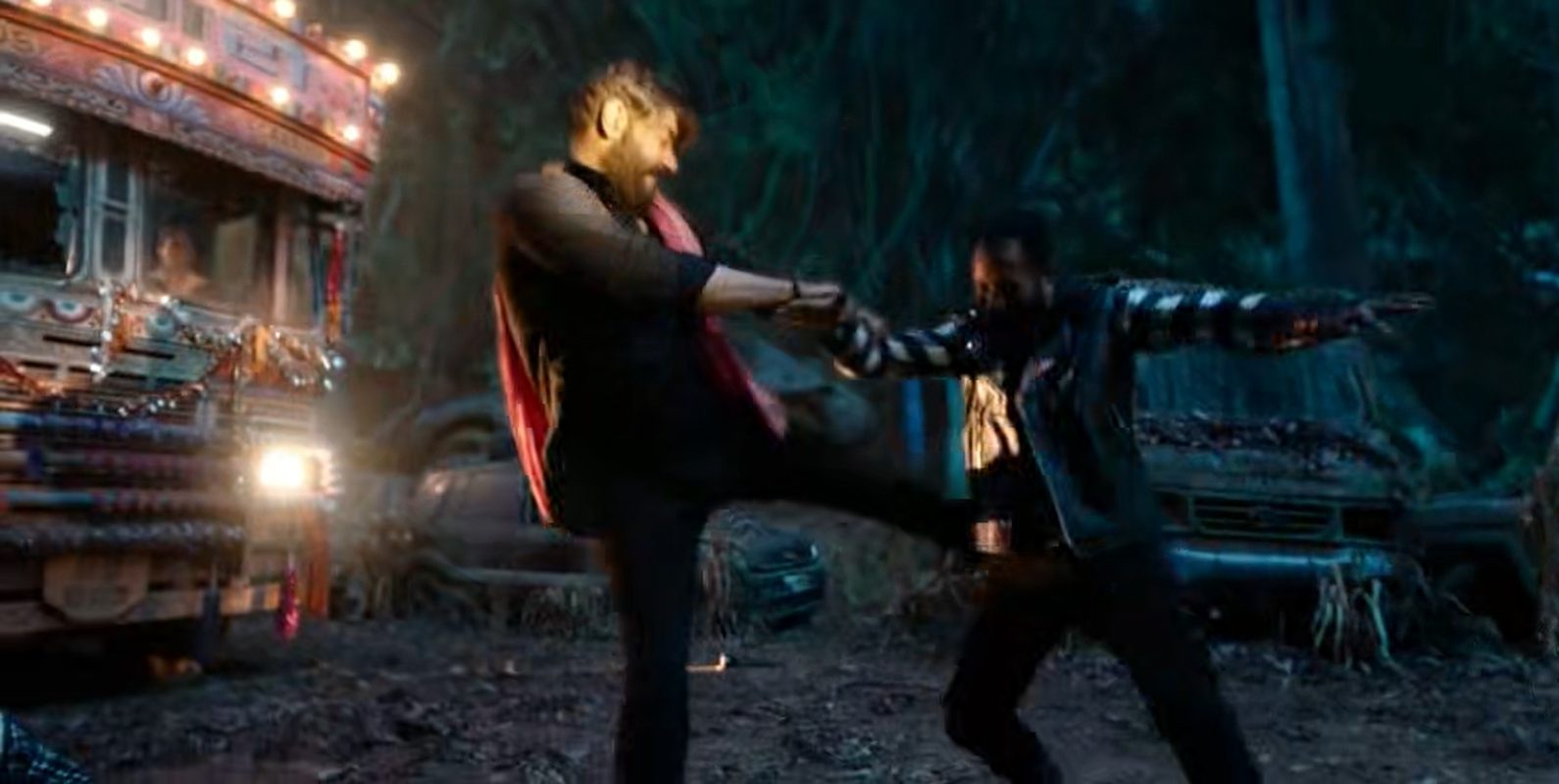Night fight next to a lit-up Indian truck
