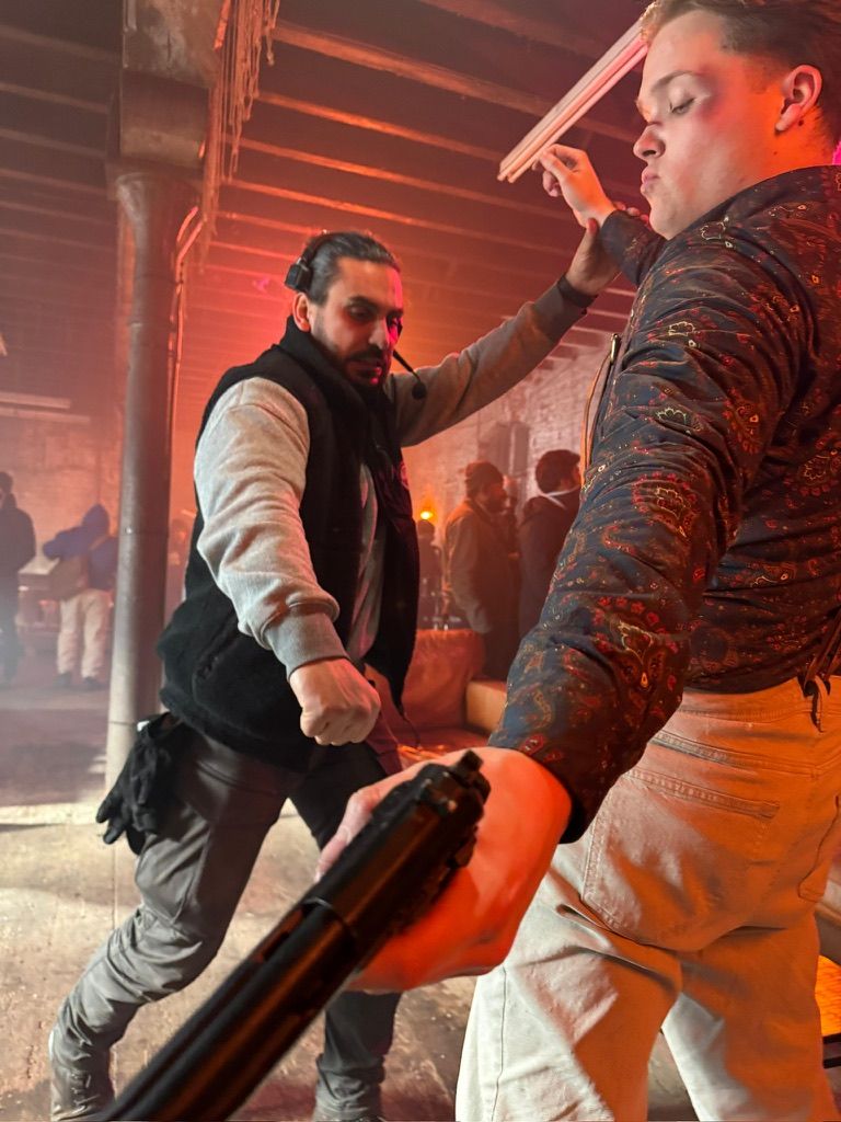 Behind the scenes: Rehearsing the fight in the warehouse under red light