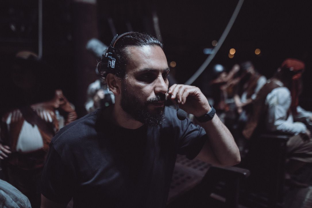 Muhammed Demirel on set with headset