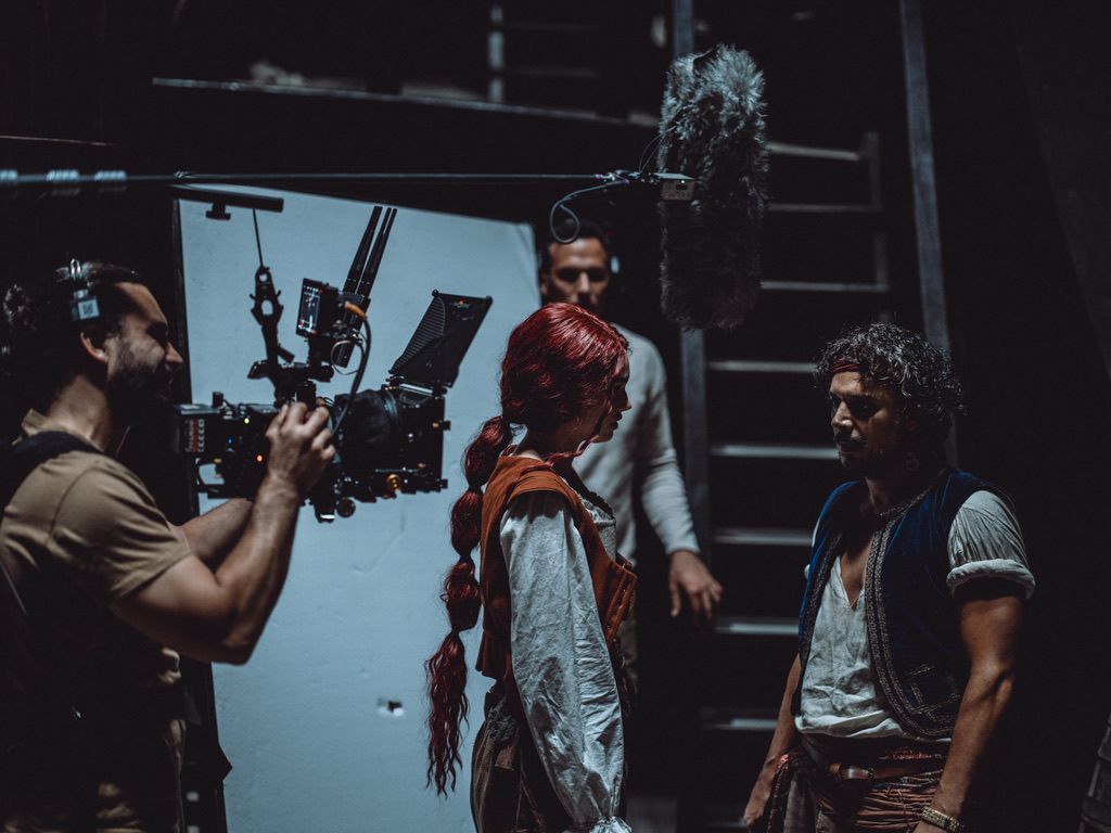 Framing the scene with the two leads